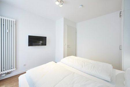 Deichhäuser Anna Küste Deichhäuser Anna Küste 4-30 Bensersiel - Schlafzimmer mit Doppelbett und Flatscreen TV