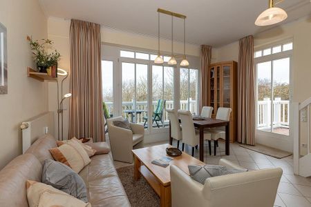 Dünenschloss Dünenschloss 1-40 Kühlungsborn - Wohn-Essbereich mit Couch