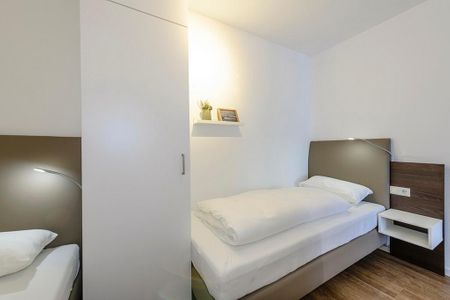 Deichhäuser Anna Küste Deichhäuser Anna Küste 1-21 Bensersiel - Schlafzimmer mit zwei Einzelbetten