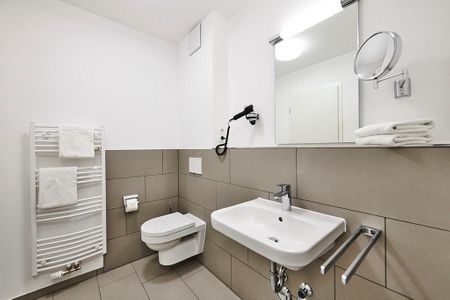 Deichhäuser Anna Küste Deichhäuser Anna Küste 2-11 Bensersiel - Badezimmer mit WC und Waschtisch