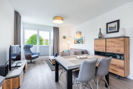 Aparthotel Ostseeallee Aparthotel Ostseeallee 3-23 Boltenhagen - Wohn-/Essbereich mit Esstisch und Sitzgelegenheiten