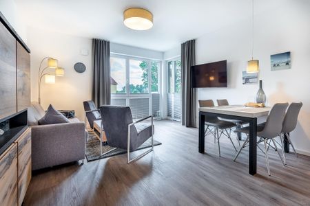 Aparthotel Ostseeallee Aparthotel Ostseeallee 3-20 Boltenhagen - Wohn-/Essbereich mit Zugang zur Terrasse