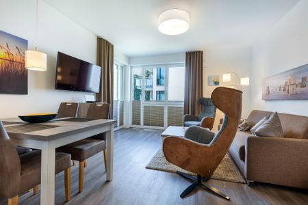 Aparthotel Ostseeallee Aparthotel Ostseeallee 4-31 Boltenhagen - Wohn-/Essbereich mit Zugang zur Terrasse