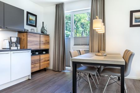 Aparthotel Ostseeallee Aparthotel Ostseeallee 5-40 Boltenhagen - Wohn-/Essbereich mit Sitzgelegenheit
