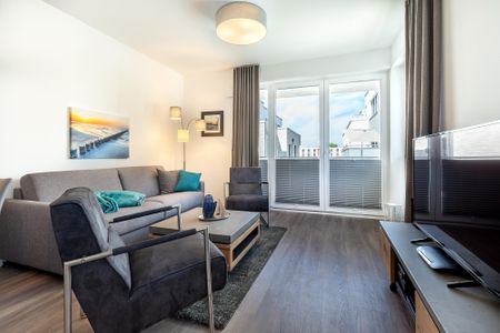 Aparthotel Ostseeallee Aparthotel Ostseeallee 5-45 Boltenhagen - Wohn-/Essbereich mit Zugang zum Balkon
