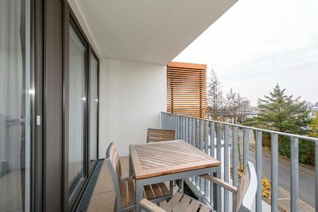 Deichhäuser Anna Küste Deichhäuser Anna Küste 4-32 Bensersiel - Überdachter Balkon mit Sitzgelegenheit