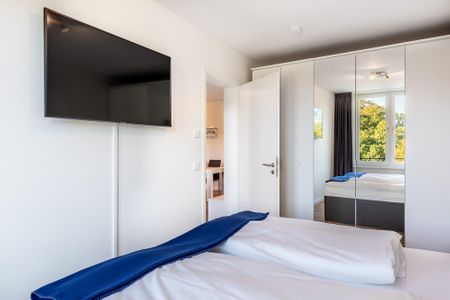 Godewindpark Travemünde Godewindpark Travemünde 2-02 Travemünde - Schlafzimmer "2" mit Kleiderschrank und Flatscreen-TV