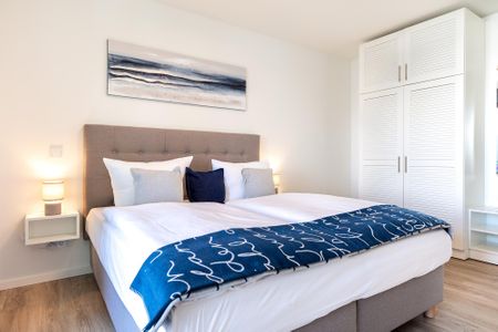 Godewindpark Travemünde Godewindpark Travemünde 2-07 Travemünde - Schlafzimmer mit Boxspringbett und Kleiderschrank