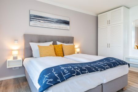 Godewindpark Travemünde Godewindpark Travemünde 1-07 Travemünde - Schlafzimmer mit Boxspringbett und Kleiderschrank