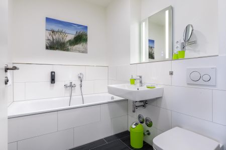 Godewindpark Travemünde Godewindpark Travemünde 3-02 Travemünde - Badezimmer "1" mit Badewanne und Waschtisch