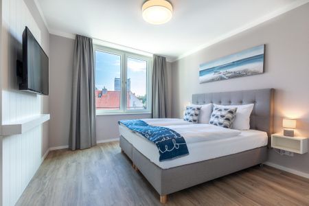 Godewindpark Travemünde Godewindpark Travemünde 3-18 Travemünde - Schlafzimmer "1" mit Boxspringbett und Flatscreen-TV