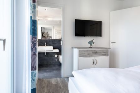 Apartmentanlage Meerblickvilla Apartmentanlage Meerblickvilla 2-31 Großenbrode - Schlafzimmer mit Zugang zum Badezimmer