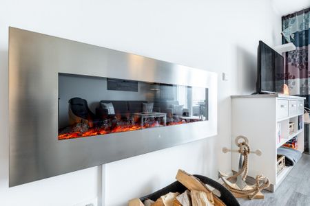 Apartmentanlage Meerblickvilla Apartmentanlage Meerblickvilla 1-07 Großenbrode - Wohn-/Essbereich mit Elektrokamin