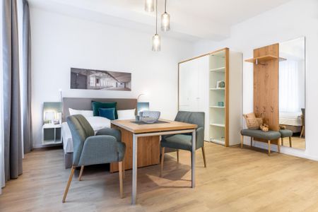 Ferienapartments am Krusespeicher Ferienapartments am Krusespeicher 0-02 Wismar - Wohn-/Schlafbereich mit Sitzgelegenheit