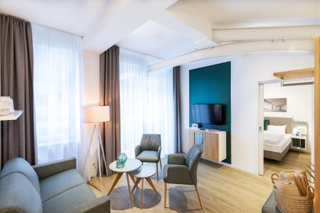 Ferienapartments am Krusespeicher Ferienapartments am Krusespeicher 1-06 Wismar - Wohn-/Essbereich mit Sitzgelegenheit