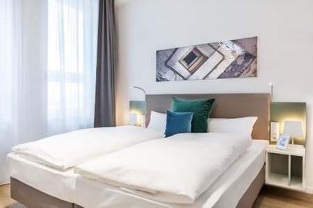 Ferienapartments am Krusespeicher Ferienapartments am Krusespeicher 2-18 Wismar - Schlafzimmer mit Boxspringbett