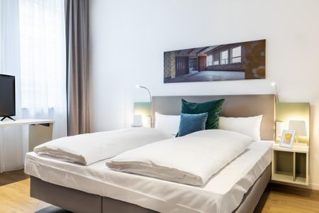 Ferienapartments am Krusespeicher Ferienapartments am Krusespeicher 3-25 Wismar - Schlafzimmer mit Boxspringbett