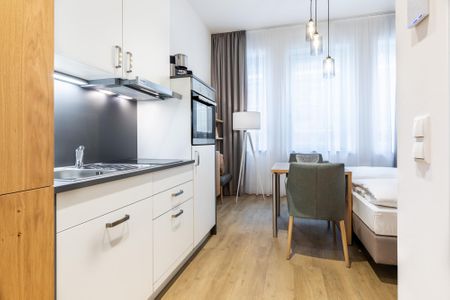 Ferienapartments am Krusespeicher Ferienapartments am Krusespeicher 3-26 Wismar - Wohn-/Schlafbereich mit Sitzgelegenheit
