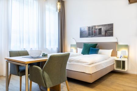 Ferienapartments am Krusespeicher Ferienapartments am Krusespeicher 3-31 Wismar - Wohn-/Schlafbereich mit Sitzgelegenheit