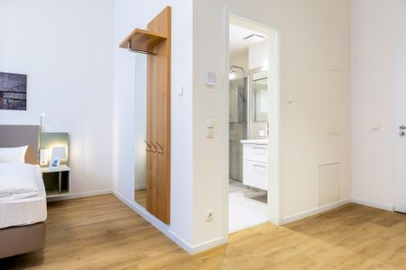 Ferienapartments am Krusespeicher Ferienapartments am Krusespeicher 3-31 Wismar - Wohn-/Schlafbereich mit Zugang zum Badezimmer