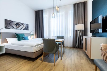 Ferienapartments am Krusespeicher Ferienapartments am Krusespeicher 3-33 Wismar - Wohn-/Schlafbereich mit Sitzgelegenheit