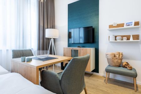 Ferienapartments am Krusespeicher Ferienapartments am Krusespeicher 3-33 Wismar - Wohn-/Schlafbereich mit Sitzgelegenheit