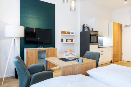 Ferienapartments am Krusespeicher Ferienapartments am Krusespeicher 3-33 Wismar - Wohn-/Schlafbereich mit Flatscreen-TV