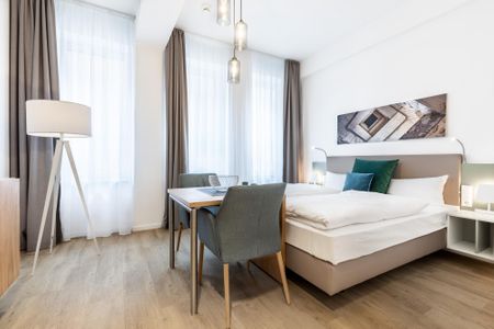 Ferienapartments am Krusespeicher Ferienapartments am Krusespeicher 1-13 Wismar - Wohn-/Schlafbereich mit Boxspringbett