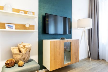 Ferienapartments am Krusespeicher Ferienapartments am Krusespeicher 1-13 Wismar - Wohn-/Schlafbereich mit Flatscreen-TV