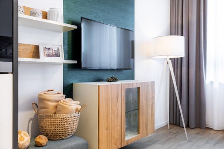 Ferienapartments am Krusespeicher Ferienapartments am Krusespeicher 3-34 Wismar - Wohn-/Schlafbereich mit Flatscreen-TV
