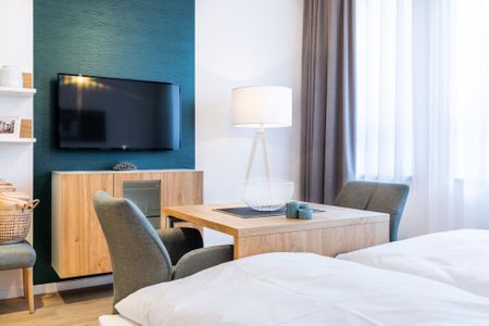 Ferienapartments am Krusespeicher Ferienapartments am Krusespeicher 3-34 Wismar - Wohn-/Schlafbereich mit Flatscreen-TV