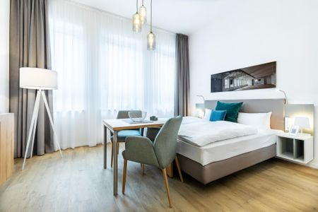 Ferienapartments am Krusespeicher Ferienapartments am Krusespeicher 3-34 Wismar - Wohn-/Schlafbereich mit Sitzgelegenheit