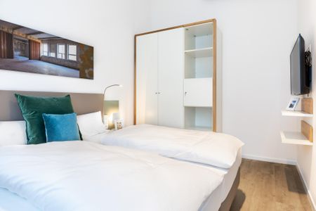 Ferienapartments am Krusespeicher Ferienapartments am Krusespeicher 3-35 Wismar - Schlafzimmer mit Flatscreen-TV