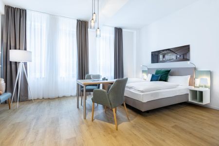 Ferienapartments am Krusespeicher Ferienapartments am Krusespeicher 2-24 Wismar - Wohn-/Schlafbereich mit Boxspringbett