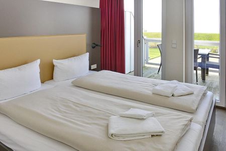 Resort Deichgraf Resort Deichgraf 27-20 Wremen - Schlafzimmer mit Doppelbett