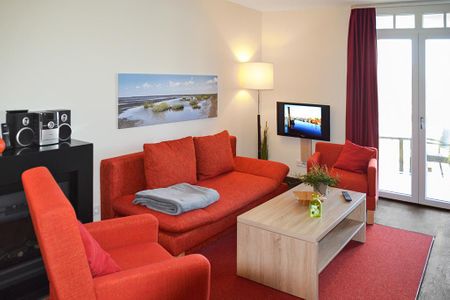 Resort Deichgraf Resort Deichgraf 27-10 Wremen - Wohn-Essbereich mit Couch