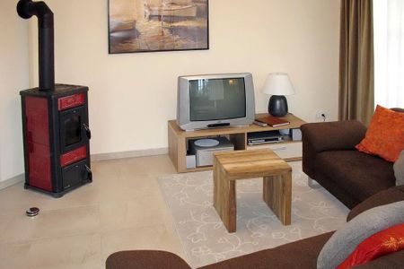 Dünenresidenz Glowe Dünenresidenz Glowe A 31 Rügen - Wohn-Essbereich mit Couch