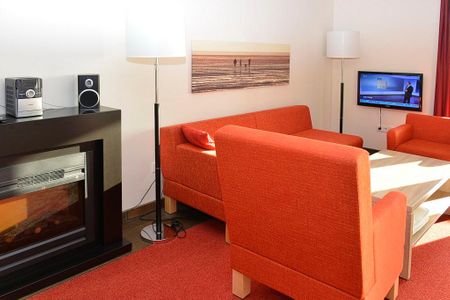 Resort Deichgraf Resort Deichgraf 27-13 Wremen - Wohn-Essbereich mit Couch