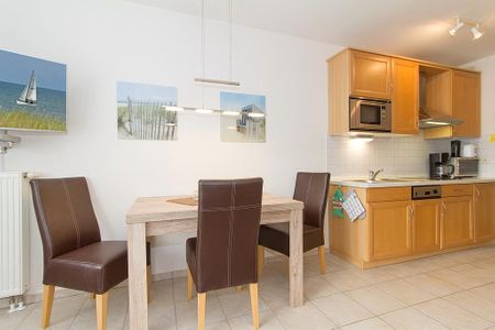 Meeresblick Meeresblick 316 Kühlungsborn - Wohn-Essbereich mit Esstisch und Sitzgelegenheit