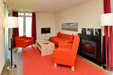 Resort Deichgraf Resort Deichgraf 31-02 Wremen - Wohn-Essbereich mit Couch