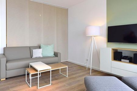 Aparthotel Anna Düne Aparthotel Anna Düne 1-21 Wangerooge - Wohn/ Essbereich mit Couch und Tisch