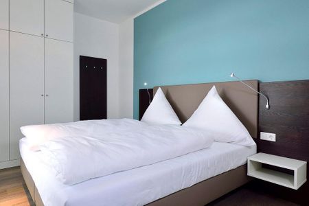 Aparthotel Anna Düne Aparthotel Anna Düne 1-25 Wangerooge - Schlafzimmer mit Doppelbett und Kleiderschrank