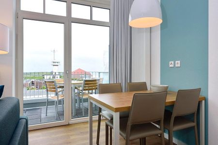 Aparthotel Anna Düne Aparthotel Anna Düne 2-27 Wangerooge - Wohn/ Essbereich mit Esstisch