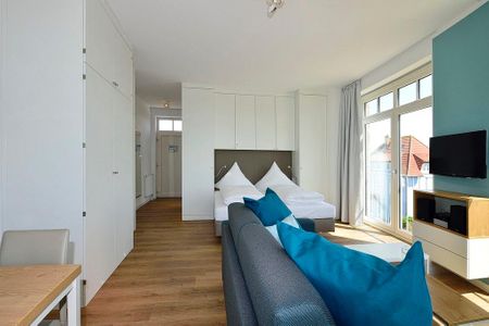 Aparthotel Anna Düne Aparthotel Anna Düne 2-27 Wangerooge - Wohn/ Essbereich mit Fernseher