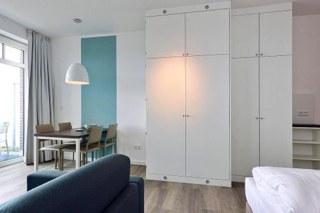 Aparthotel Anna Düne Aparthotel Anna Düne 2-30 Wangerooge - Wohn/ Essbereich mit Esstisch
