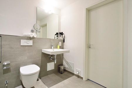 Aparthotel Anna Düne Aparthotel Anna Düne 2-32 Wangerooge - Badezimmer mit WC und Waschtisch