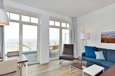 Aparthotel Anna Düne Aparthotel Anna Düne 2-34 Wangerooge - Wohn/ Essbereich mit Couch, Sessel und Tisch