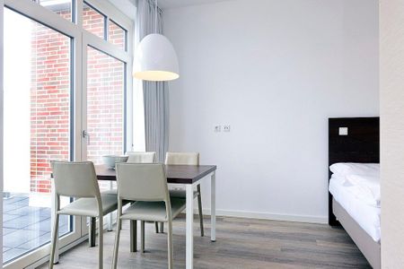 Aparthotel Anna Düne Aparthotel Anna Düne 2-35 Wangerooge - Wohn/ Essbereich mit Esstisch
