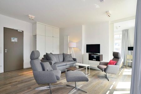 Aparthotel Anna Düne Aparthotel Anna Düne 2-39 Wangerooge - Wohn/ Essbereich mit Fernseher