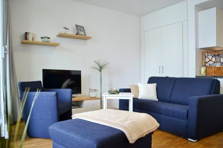DünenResort Binz DünenResort Binz 419 Rügen - Wohn-Essbereich mit Couch